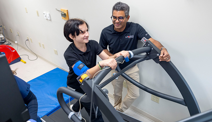child on treadmill with sports cardiology physician